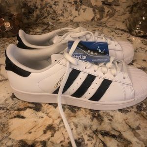 Women Adidas Superstar shoes.
